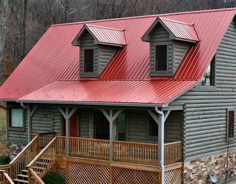 grey house with red metal roof|grey house with black awnings.